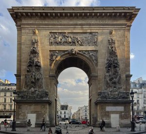 arched Porte Saint-Denis monument in Paris with detailed sculptures
