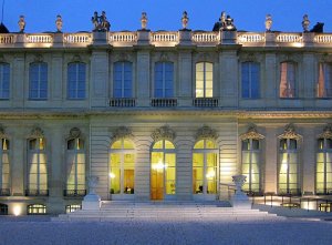 ornate entrance with wrought iron gates and classical architectural details at Hôtel de Lassay in Paris