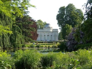 Springtime blooming flowers and lush green garden at Parc de Bagatelle