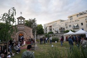 Foujita Chapel during festive event with crowd in Reims