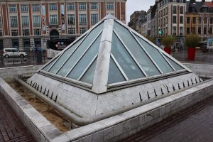 Glass pyramid fountain serving as light well at Rihour metro station