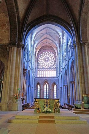 Interior view of Saint-Malo Cathedral showing gothic architecture and commemorative plaque in aisle