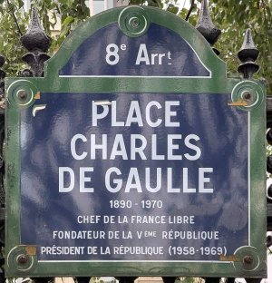 Place Charles de Gaulle name plaque mounted on a stone wall in Paris