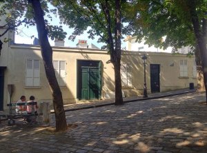 Front façade of the Bateau-Lavoir artist studios building in Paris showing its unique architectural elevation