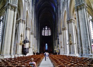 Nave of Reims Cathedral with high vaulted ceilings and Gothic architecture