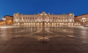 Capitole building and square with Occitan cross designed by Raymond Moretti at night in Toulouse