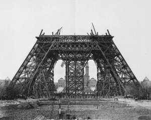 Horizontal beams being assembled on scaffolding during Eiffel Tower construction