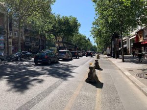 Boulevard Montmartre street with Parisian buildings and pedestrians