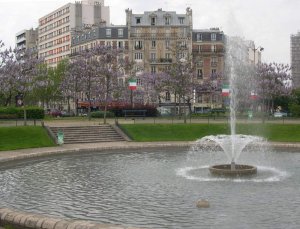 View of Place d'Italie, a busy urban square in Paris with surrounding buildings and street traffic
