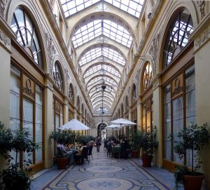 Interior view of Vivienne Gallery covered passage in Paris with elegant shops and glass roof