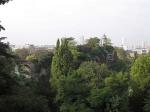 Scenic view of Parc des Buttes-Chaumont in Paris with lush greenery and park features