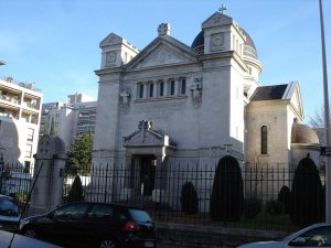 Facade of Chapelle Sainte-Croix de Lyon with memorial inscription honoring victims of the siege of Lyon