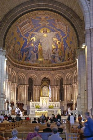 Interior view of Sacré-Cœur Basilica showing choir, apse, and mosaic details