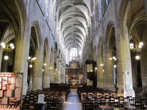 Interior view of Saint-Nicholas-des-Champs church in Paris showing architectural details and lighting