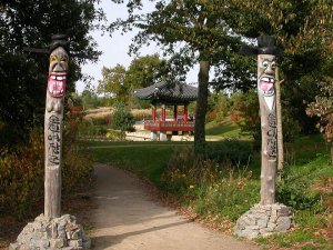 Korean pavilion and traditional wooden jangseungs on Suncheon Hill in Grand-Blottereau Park, Nantes