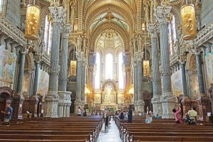 ornate interior view of the upper sanctuary of Basilica of Notre-Dame de Fourvière with elaborate decorations