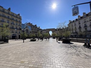 View of Darcy Square in Dijon featuring the central fountain and surrounding buildings