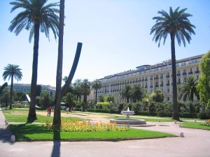 Main esplanade of Albert I Garden with Bernard Venet arc sculpture in the background in Nice