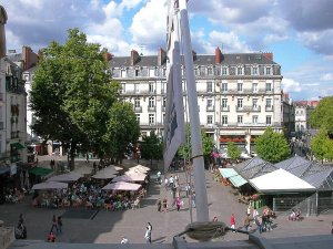 The Place du Commerce, a historic city square in Nantes, France, showing elegant buildings and outdoor seating areas