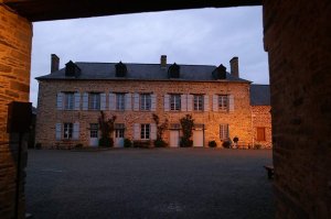 Exterior view of Écomusée de la Bintinais illuminated at night during museum night event