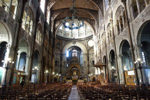 Interior view of Saint-Augustin Church featuring architectural details and stained glass windows