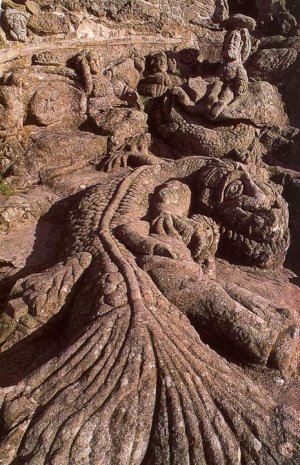 Close-up view of detailed rock sculptures carved by Abbé Fouré at Rothéneuf