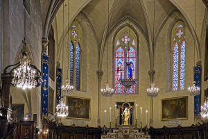Interior view of Notre-Dame-de-l'Espérance church in Cannes showing architectural details and altar