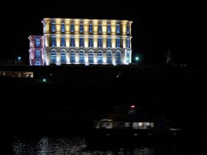 Palais du Pharo illuminated at night in Marseille