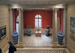 Interior view of the grand hall at Musée Cernuschi with neoclassical architectural elements