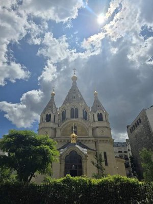 Facade of Alexander Nevsky Cathedral in Paris with distinct domes