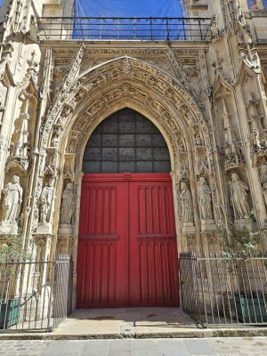 ornate entrance portal of Saint-Merri church in Paris with detailed stone carvings