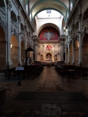 Interior view of Saint-Polycarpe Church nave and choir in Lyon