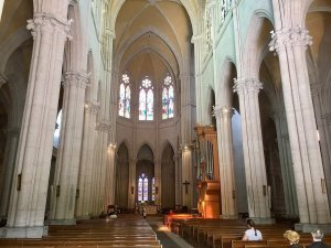 Nave interior of Eglise de la Redemption church in Lyon with visible arches and ceiling