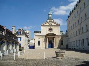 view of Notre-Dame-de-la-Paix chapel and entrance to Picpus Cemetery in Paris