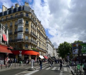 Street scene along Boulevard Marguerite-de-Rochechouart in Paris with urban buildings and road