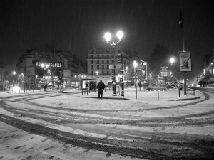 Street view of Place Pigalle with surrounding buildings and pedestrians in Paris