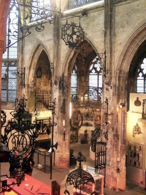 Interior view of Musee Le Secq des Tournelles in Rouen showcasing wrought iron artifacts