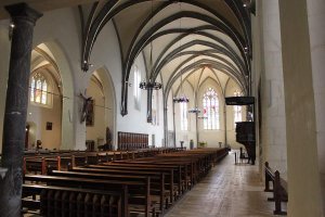 Interior view of Église Saint-Maurice in Annecy, showing architectural details and decorative elements