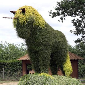 Unicorn sculpture surrounded by greenery at Terra Botanica