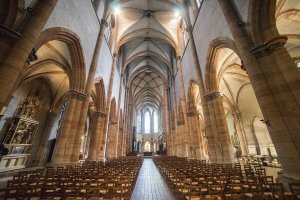 Interior view of the nave at St Martin's Church in Colmar with architectural details