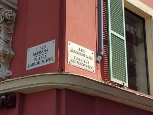 Street sign of Place Masséna in Nice showing local Ligurian language name