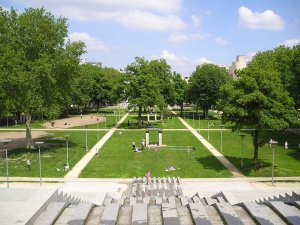 lush green Prairies garden area in Parc de Bercy with trees and open space