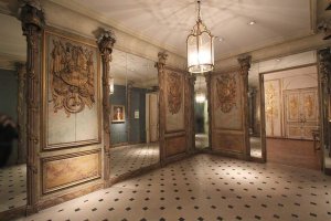 Interior view of exhibit rooms at the Carnavalet Museum in Paris with historical displays