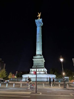 nighttime view of the illuminated July Column monument
