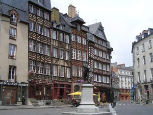 Medieval house and statue of Jean Leperdit in Place du Champ-Jacquet, Rennes