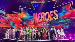 Participants standing on stage at the jury show inside Palais Nikaia
