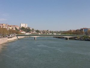 Morand Bridge spanning the river in Lyon with urban surroundings