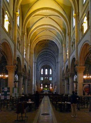 Interior nave of Saint-Ambroise Church in Paris showing architectural details and lighting