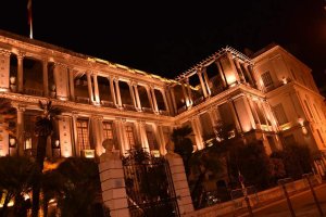 Nighttime view of the illuminated façade of Palais des ducs de Savoie