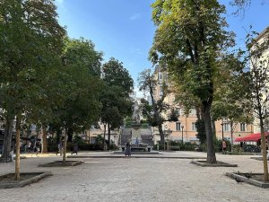 View of Place Sathonay square in Lyon with urban buildings and streetscape